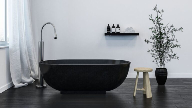 Chauffage au sol salle de bain carrelage noir immitation parquet.