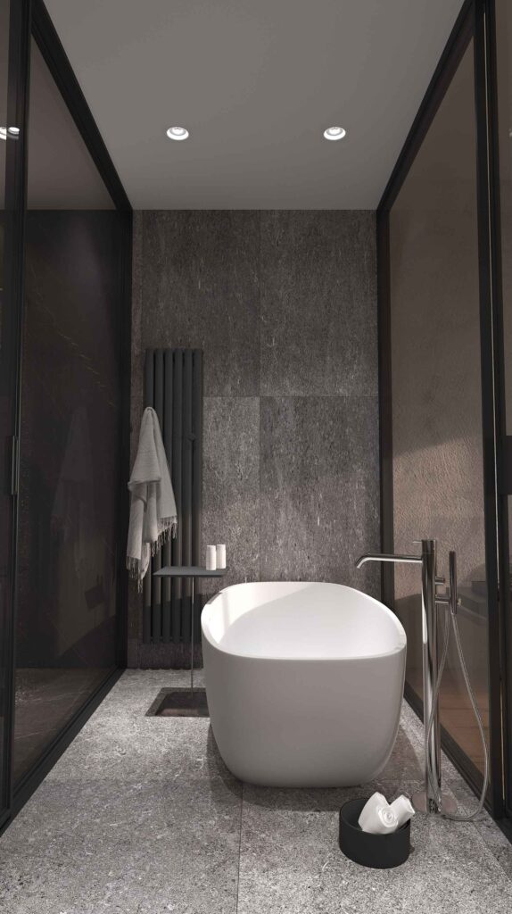Salle de bain contemporaine, grands carreaux effet granit gris foncé et baignoire îlot